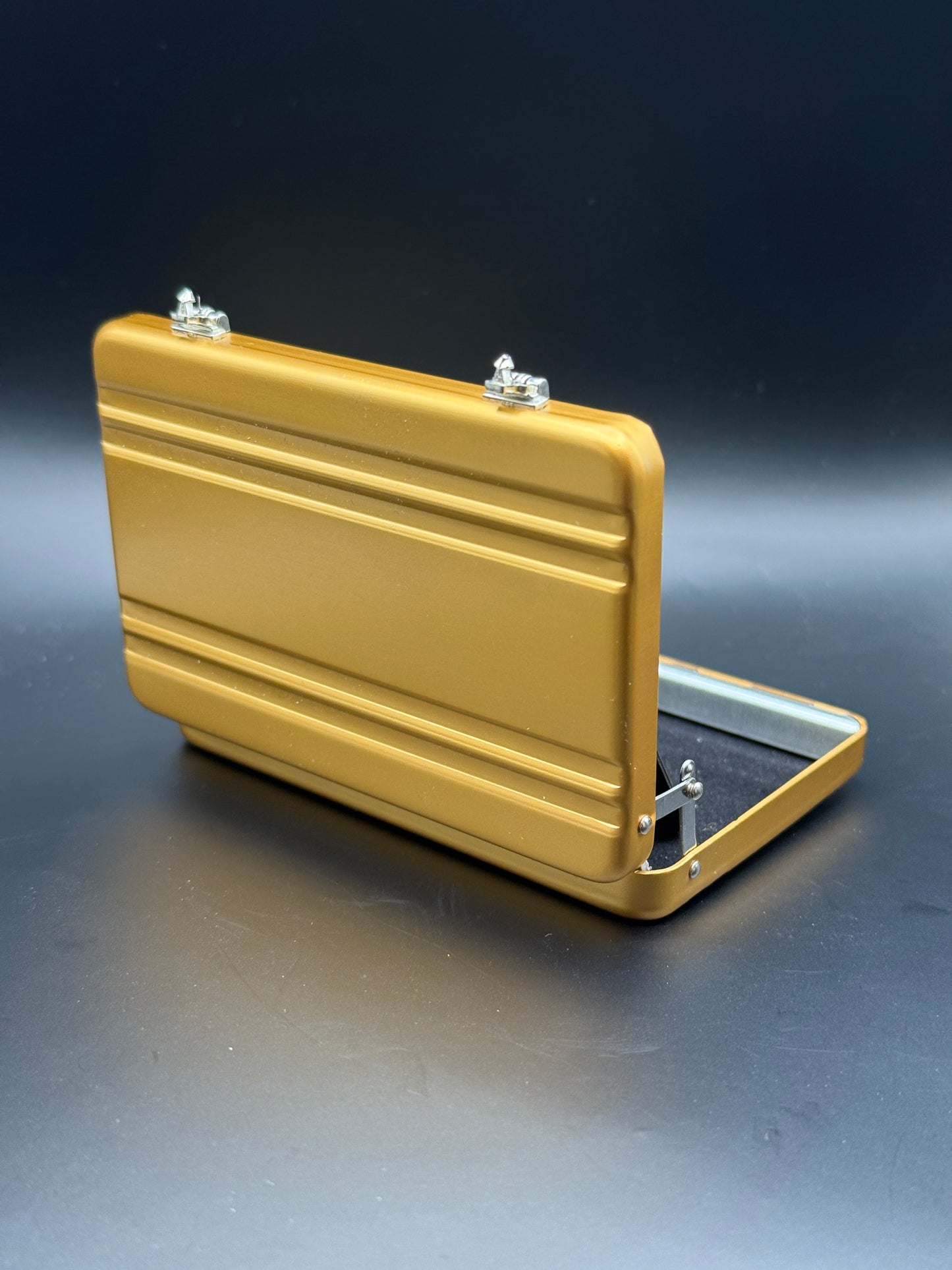opened metal mini gold briefcase wallet