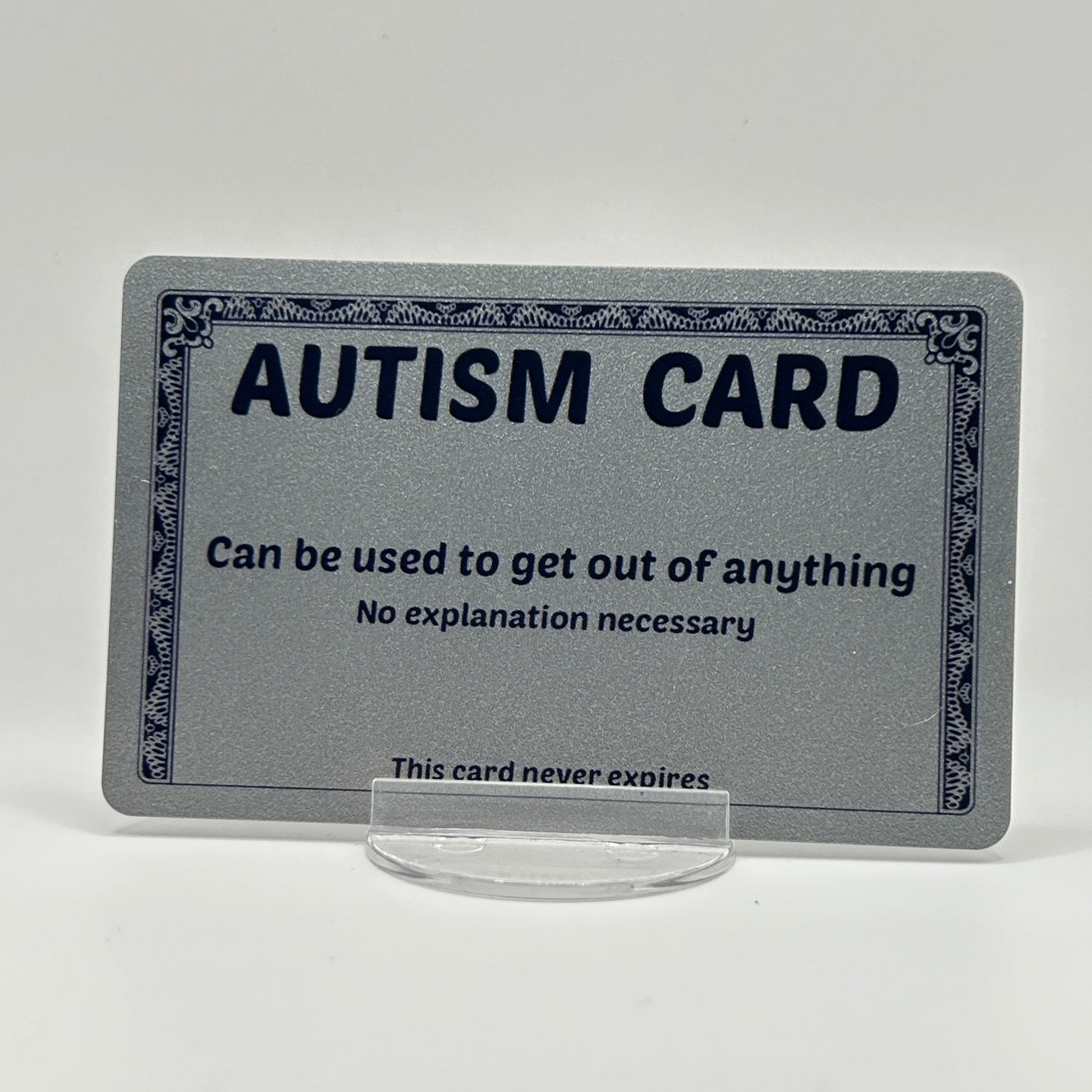 A plastic silver autism card